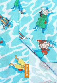 Blue camouflage patterned fabric featuring various cartoon characters, with an orange tag that reads "OPPOSUITS."  Textured cotton material.