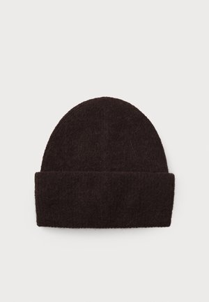 Bonnet en laine noire avec un revers plié, présenté à plat sur un fond blanc uni.