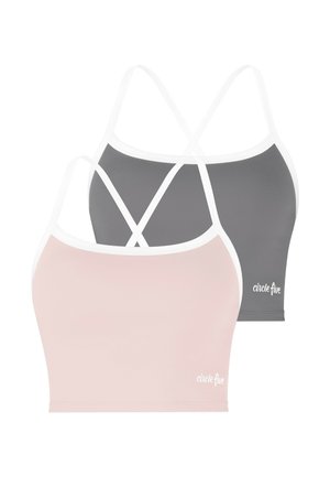 Zwei nahtlose Croptops mit dünnen gekreuzten Trägern, eines in Hellrosa und eines in Dunkelgrau, beide mit dem Text "circle five".