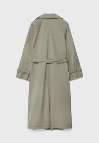 Khaki trenchcoat, pitkä malli, jossa on kaulus, vyötärövyö ja käännetyt hihat. Sileä kangas, jossa on hieman kiiltoa, takana laskostus.