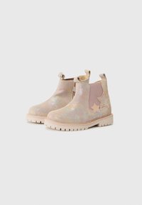 Iridescent ankle boots featuring a textured upper, beige elastic side panels, and star accents on the sides with a rugged sole.