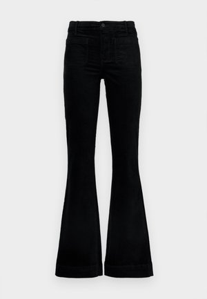 Melnas kordurojas zvana bikses ar augstu jostasvietu, četrām kabatām un plašām kājām, teksturētu audumu un pogu un rāvējslēdzēja aizdari.