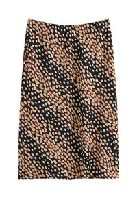 Svart kjol med prickigt mönster i beige och burgundyröda nyanser, mjuk textur, knälängd och elastisk midja.