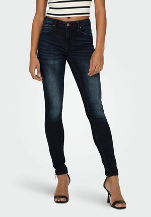 Skinny jeans van donkerblauwe denim, met een hoge taille, vijf zakken en een gladde textuur. Versterkt met een rits bij de enkel.