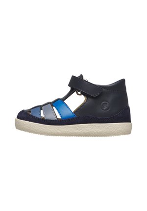 Children's navy leather sandal with blue and gray straps, Velcro closure, and white textured sole, shown in side profile.