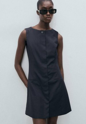 Dark gray sleeveless dress with a round neckline, button detail, vertical pinstripes, and two front pockets. Smooth texture.