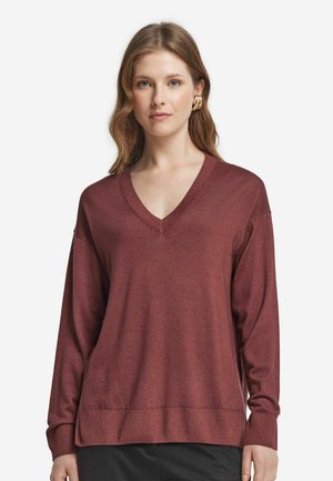 Pull en V bordeaux avec des manches longues, des poignets et un ourlet côtelés. Texture douce et coupe décontractée, idéal pour un style décontracté.