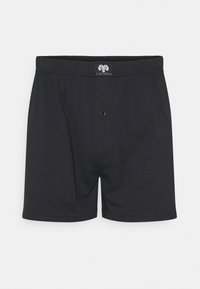 Boxer in cotone nero uniforme con una vestibilità comoda, dotati di un elastico in vita e una chiusura a bottone sul davanti.