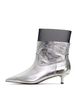 Silver metallic ankle boot with a pointed toe, featuring a textured leather finish and a black fabric upper cuff. Kitten heel design.