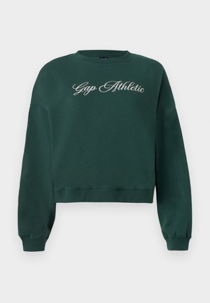 Mørkegrønn cropped sweatshirt med lange ermer og "Gap Athletic" brodert i hvit kursiv over brystet.