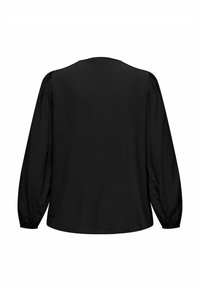 Blusa nera a maniche lunghe con vestibilità rilassata, texture a costine e dettaglio arricciato ai polsi. Tessuto liscio, design semplice.