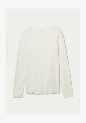 Langarm T-shirt met ronde hals in gebroken wit, vervaardigd uit zachte katoen, met een geschulpte zoom en subtiele textuur.