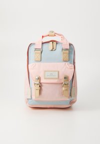 Backpack with light pink and blue sections, featuring beige accents, a logo patch, two front buckles, and a top handle. Textured fabric.