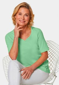 GOLDNER MIT CHARMANTEM AUSSCHNITT - T-shirt print - light green