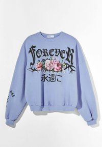 Sweat-shirt violet clair avec le texte noir "FOREVER" et des graphiques floraux. Manches longues avec poignets côtelés, coupe décontractée et détails brodés.