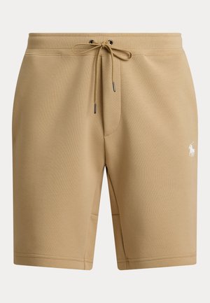 Short beige décontracté avec taille à cordon et petit logo blanc de joueur de polo sur la cuisse droite.