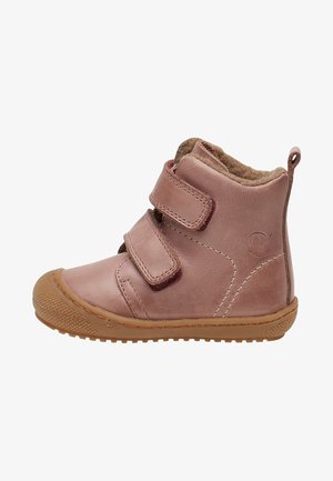 Pink toddler boot with two velcro straps, light brown rubber sole, and soft fleece lining visible at the ankle collar.