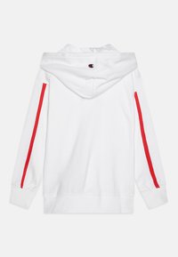 Vit sweatshirt med luva, med röda sidostrpcar. Tillverkad av mjukt material, har ribbade ärmslut och nederkant, samt en logotyp på baksidan.