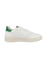 White leather sneaker with green accents on the heel, textured surface, padded collar, and a thick, rubber sole with traction grooves.