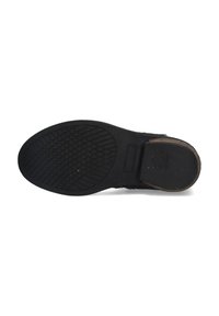 Black sole with textured tread pattern, rounded shape, and slight heel. Reinforced edges provide durability. Measurements visible on the sole.