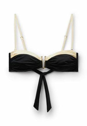Schwarz-beiger Bikini-Oberteil mit dünnen verstellbaren Trägern, goldener vorderer Schnalle und schwarzer Bindeverzierung, die unter der Brust hängt.