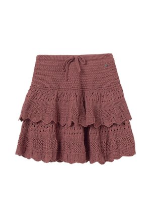 Jupe au crochet de couleur rose poussiéreux avec un design à volants. Elle possède une taille élastique avec un lien et des motifs en dentelle détaillés.