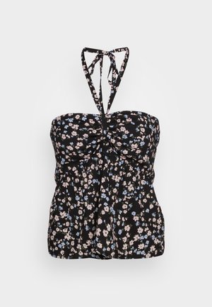 Haut noir à col halter avec petit imprimé floral rose et bleu et détail froncé à l'avant.