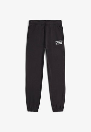 Pantaloni neri da jogging con fascia elastica in vita, polsini a costine, tasche laterali e logo O'Neill bianco sulla coscia sinistra. Materiale morbido, vestibilità comoda.