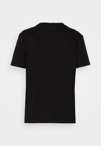 Svart kortärmad t-shirt med rund hals visad bakifrån på en enkel ljus bakgrund.