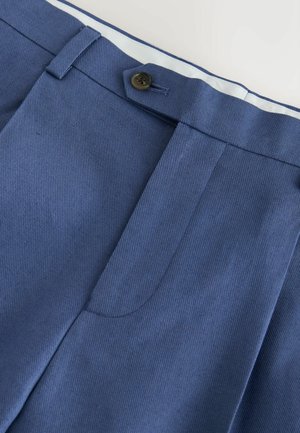 Blue tailored trousers with a buttoned waistband and concealed fly, showing fabric texture and belt loops on a white background.