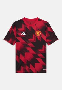 Röd och svart sporttröja med kort ärm och zickzackmönster, Adidas-logga och Manchester United-emblem. Tillverkad i lätt material.