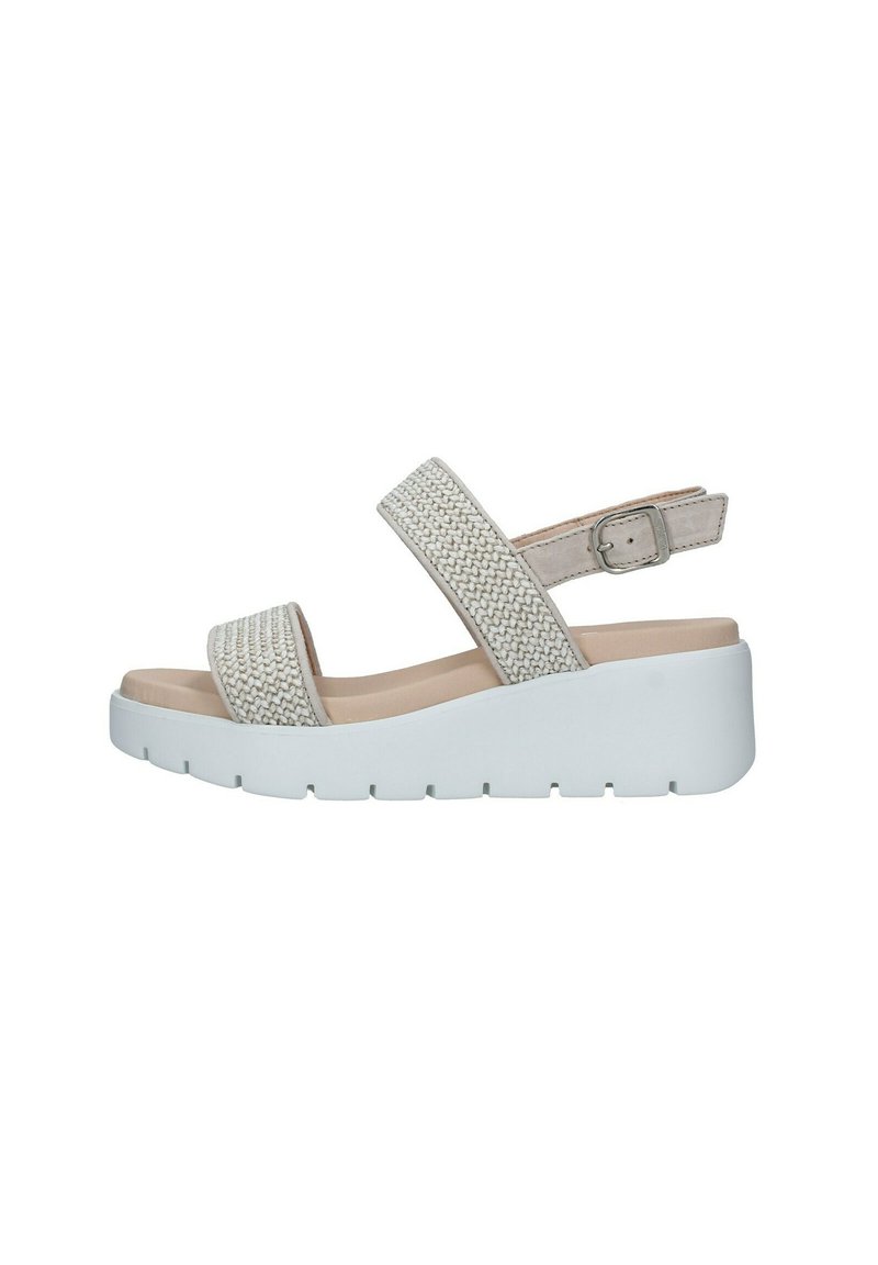 Sandalo con zeppa con tomaia intrecciata in beige chiaro, cinturino alla caviglia regolabile e suola piattaforma bianca con fondo testurizzato per una migliore aderenza.