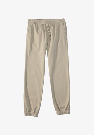 Beige Baumwoll-Jogginghose mit elastischem Bund, Kordelzug, Seitentaschen und schmal zulaufenden Bündchen. Glatte Textur ohne sichtbare Muster.