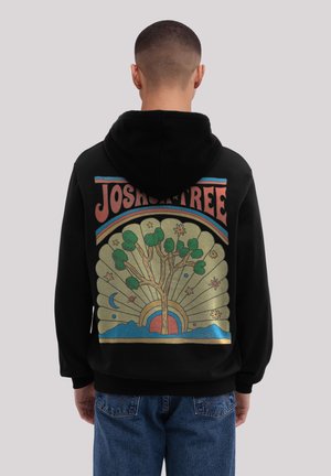 Black hoodie featuring a colorful graphic on the back with a stylized tree, rainbow, and celestial elements against a golden background.