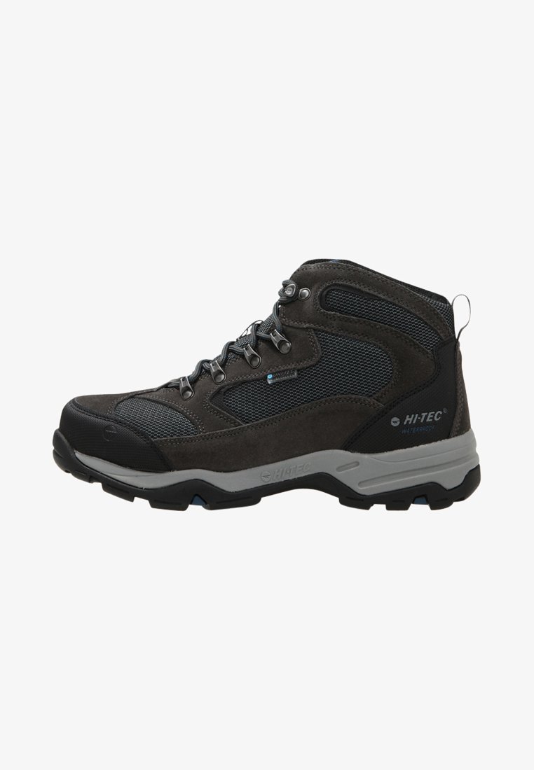 Mid-top hiking boots in grey and black synthetic materials with mesh panels, lace-up closure, reinforced toe, and rugged outsole for traction.