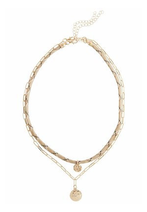 Gold-tone layered necklace featuring a mesh chain and paperclip links, with a textured circular pendant. Adjustable length with a clasp closure.