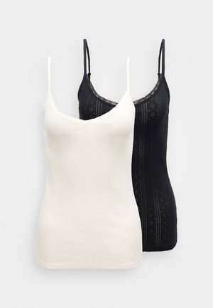 Two camisoles, one white and one black, featuring thin adjustable straps, a v-neckline, and a textured pattern with lace accents.
