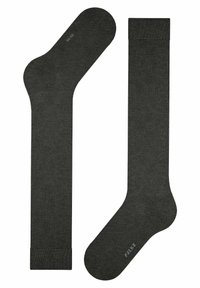 Calze grigie scure realizzate in un materiale a maglia testurizzata. Presentano una punta rinforzata, supporto arco e un polsino liscio ed elastico. Logo del marchio visibile.