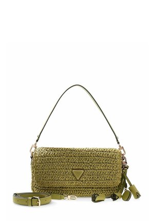 Sac bandoulière en tissu vert olive avec bandoulière amovible, petit logo triangulaire et accents de pompons floraux sur fond blanc.