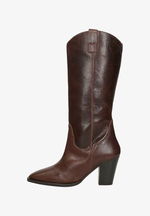 Brown leather knee-high boot with pointed toe, curved top, and a chunky heel. Features a smooth texture and minimal accents.