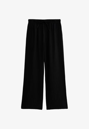 Pantalons larges noirs en tissu texturé, dotés d'une taille élastique avec cordon de serrage pour un ajustement réglable.