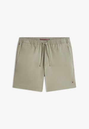 Svijetlosmeđe muške kupaće hlače s elastičnim pojasom, vezicama, bočnim džepovima i malim crvenim, bijelim i plavim logom na rubu lijeve nogavice.