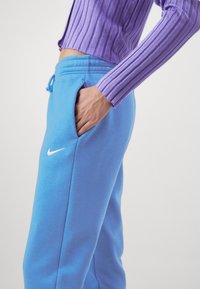 Nike Sportswear Träningsbyxor - blue