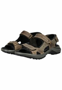 Sandali in cuoio marrone con cinturini regolabili in velcro, design aperto, suole interne texturizzate e suole in gomma con motivi antiscivolo per una migliore aderenza.