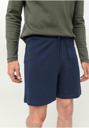 Pantaloni corti in cotone di colore blu navy con vita elastica e cordoncino regolabile, dotati di tasche laterali e taglio dritto.