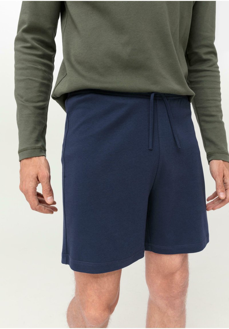 Marineblaue Baumwollshorts mit elastischem Bund und verstellbarem Kordelzug, ausgestattet mit Seitentaschen und geradem Schnitt.