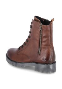 Brun läderankelstövel med snörning och dragkedjestängning, rund tå, gummisula och kontrasterande sömmar. Gummibetäckningar vid hälen.