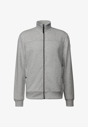 Grå zip-up jakke med høj krave, struktureret strikkemønster og sort lynlås. Har ribbede manchetter og kant, samt sidelommer.