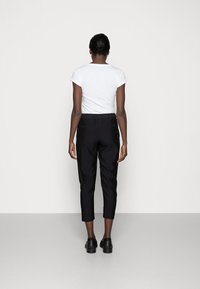 AllSaints Kalhoty - black