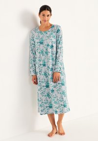 Blommig nattsärk i ljusgrått med turkosa blommor, långa ärmar, rund halsringning, mjukt tyg, knälång design och avslappnad passform.